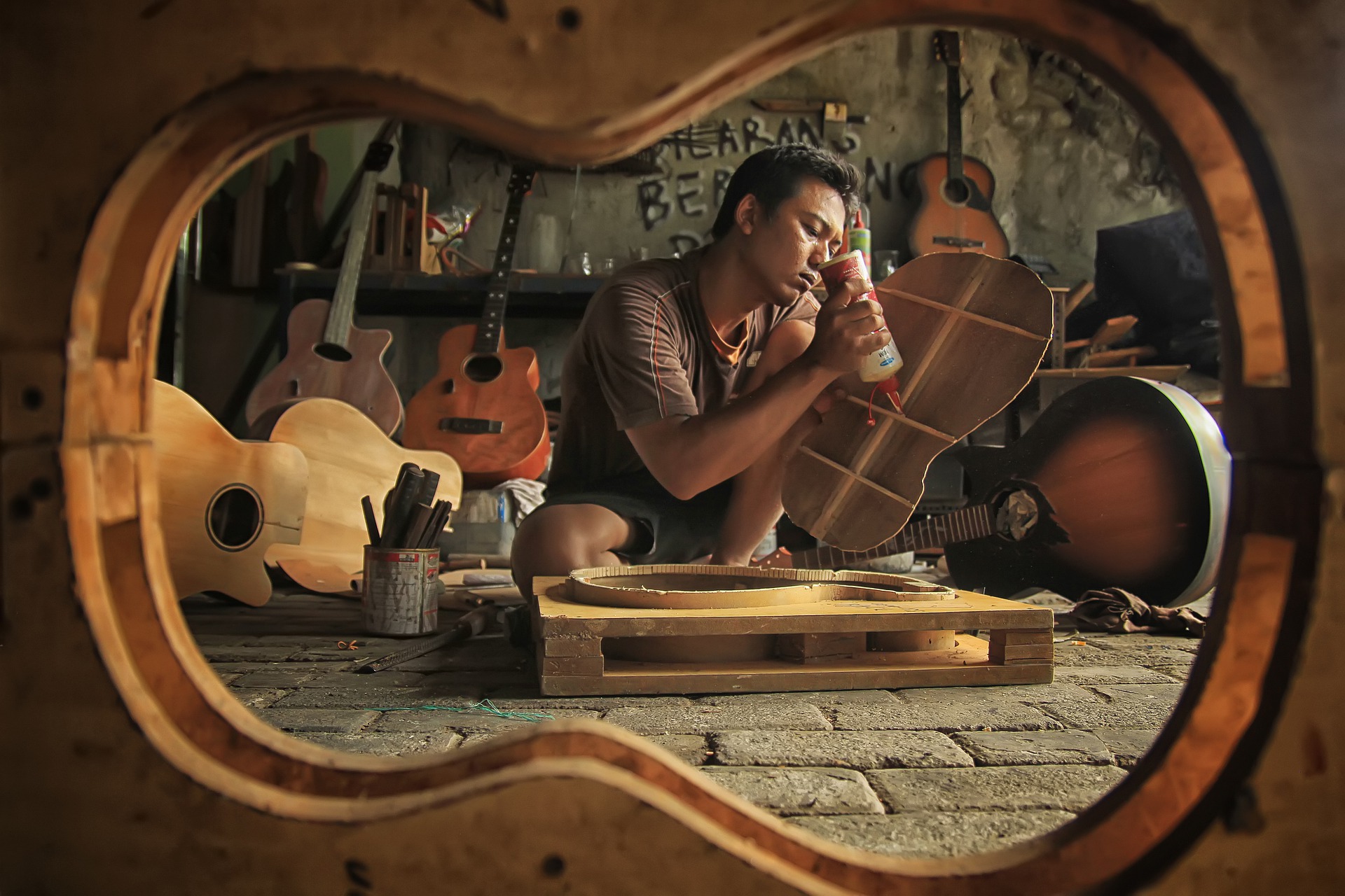 A man working on a hand-made guitar