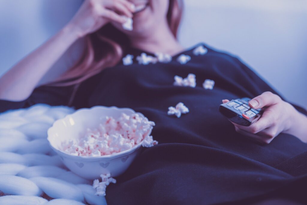 Woman eating popcorn