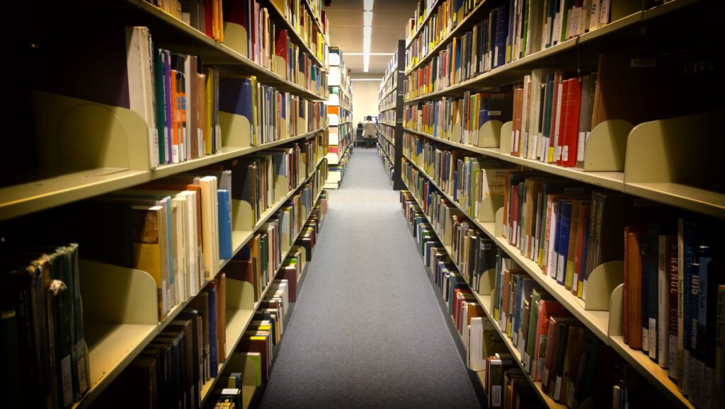 Library shelves stretching into the distance