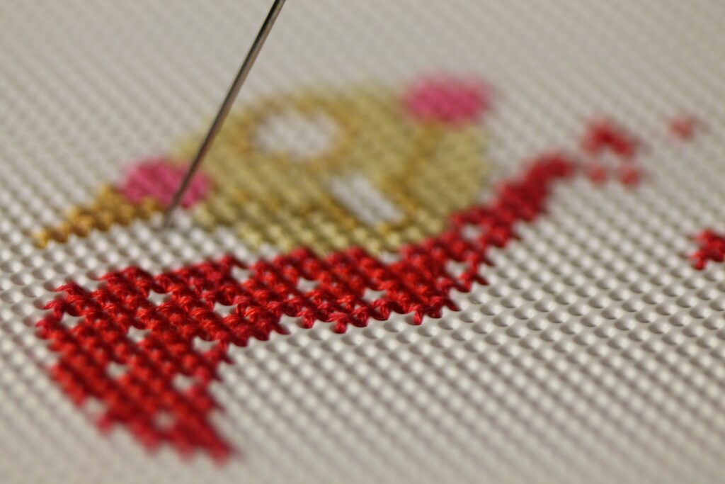 close up of cross stitching on fabric