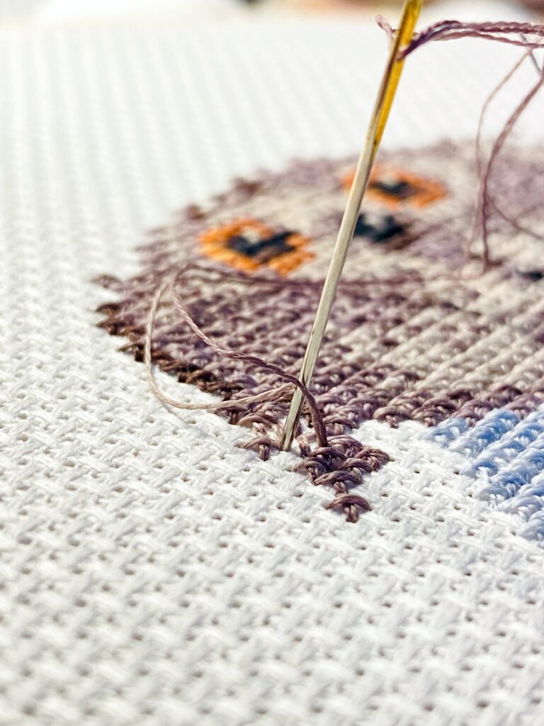 cross stitched owl on fabric
